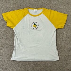 Bright yellow and white shirt with lemon graphic